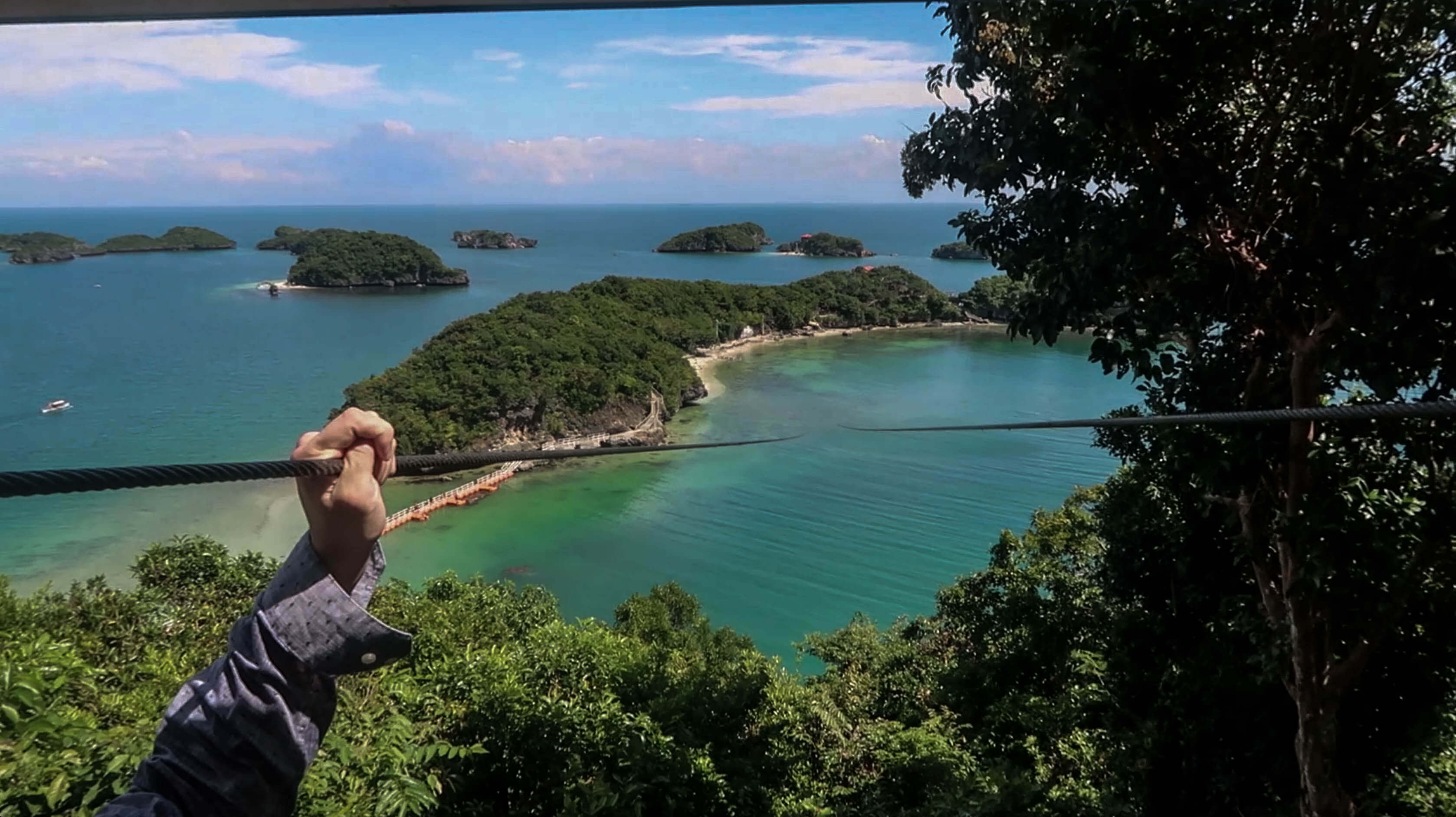 zip-line going from governor's island to virgin island at hundred islands nature park in pangasinan philippines